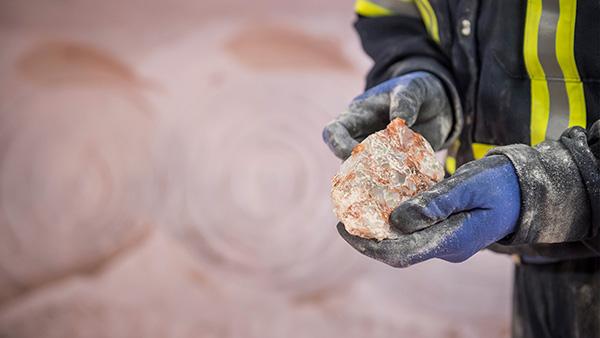 Person holding potash rock